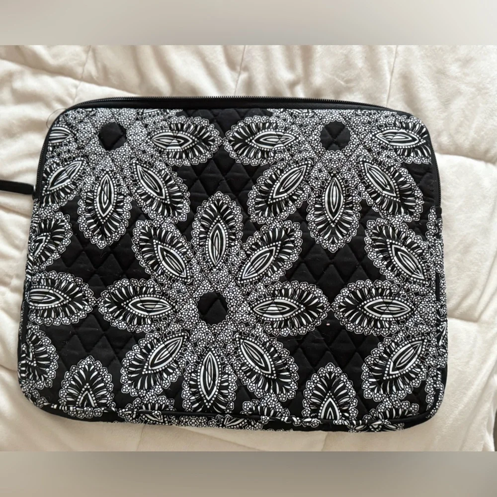 Vera Bradley Black and White Quilted laptop sleeve with zipper closure.
